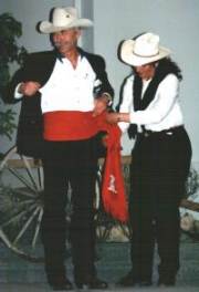 Hugh being fitted with the Red Sash Award